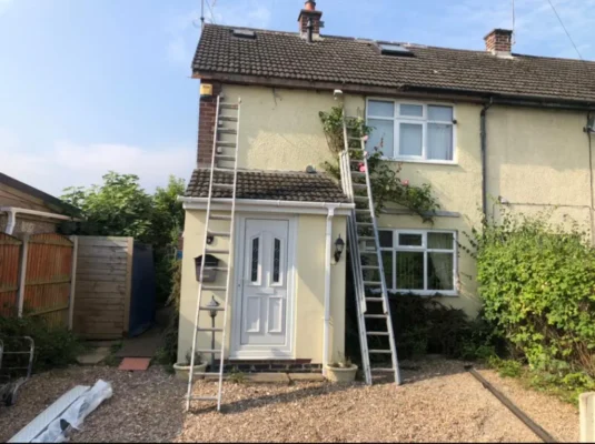 Affordable roofing company plymouth: Trident Roofing Ltd professionals performing a home roof inspection via ladders.