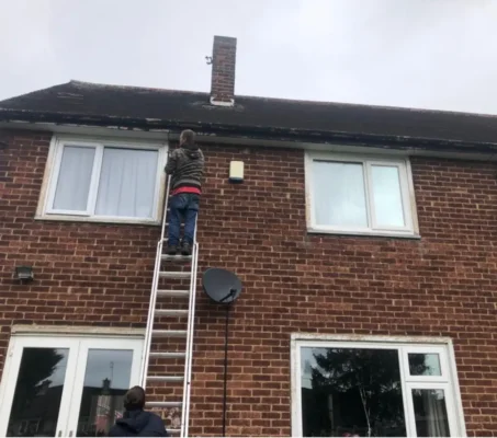 A professional team member from Trident Roofing Ltd, a leading roofing company Plymouth residents trust, performing a roof inspection and maintenance service.