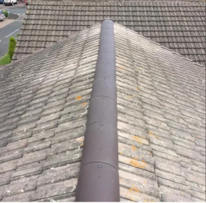 Trident Roofing Ltd expert roofing Plymouth: high-angle view of a professionally installed dry ridge system on a tiled roof.